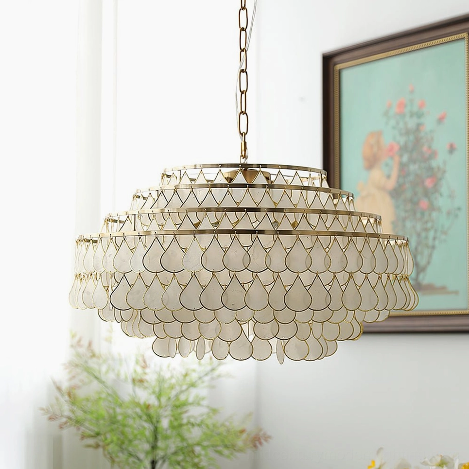 Tiered shell pendant lamp showing light diffusion through matte white shell panels, creating soft ambient glow in dining space