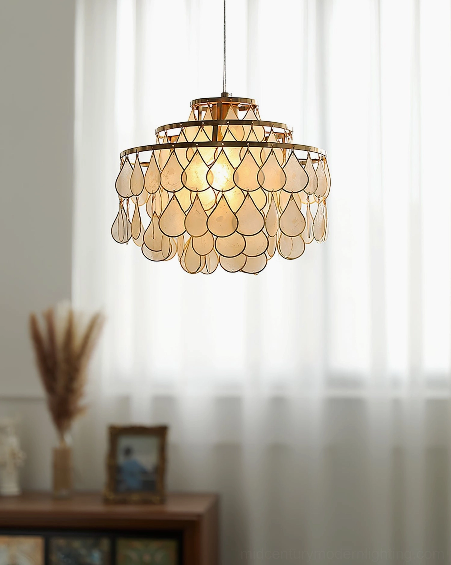 Shell pendant lamp as focal point in mid-century modern dining room, complementing period furniture and vintage accessories
