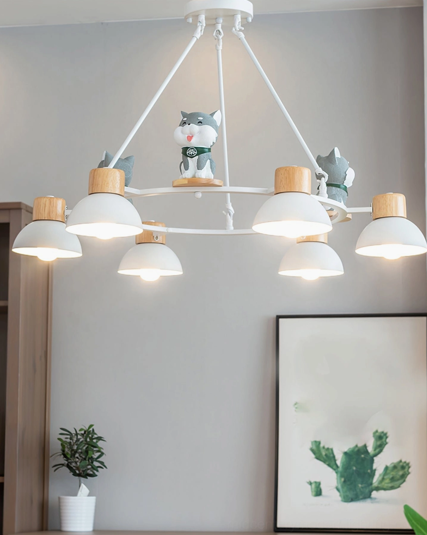 Shiba Inu pendant chandelier architectural detail with resin figurines and metal framework close-up