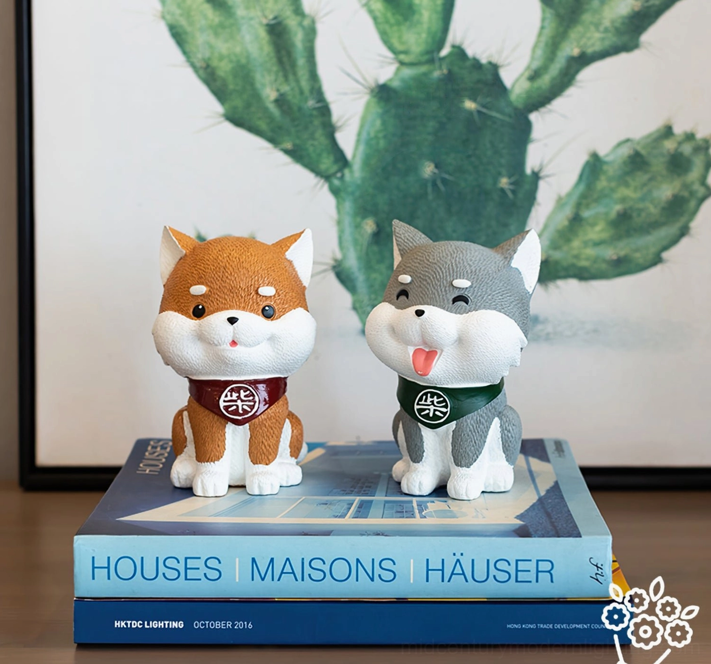 Shiba Inu resin figurine details on pendant chandelier, desk styling with design books and cactus wall art