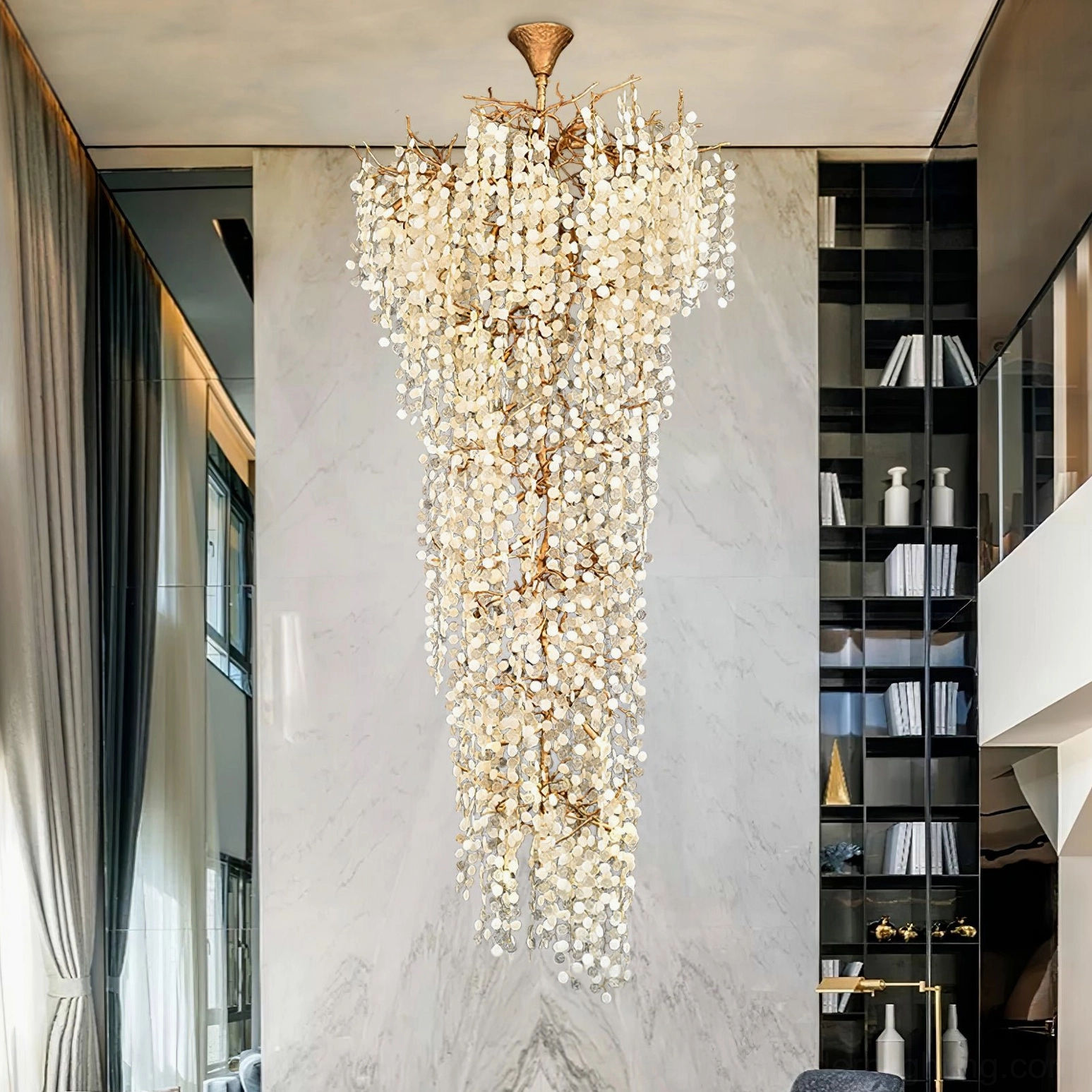 Shiro Noda chandelier in modern entryway with marble walls and architectural shelving mid-century modern style