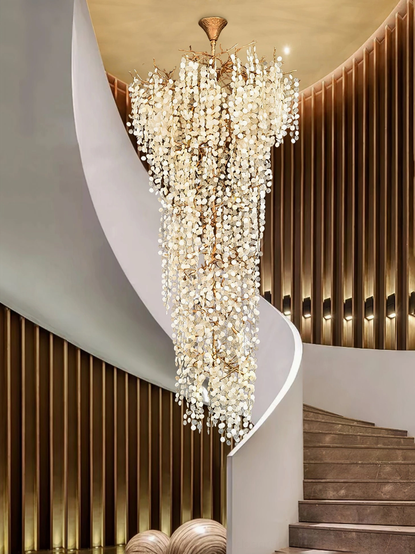 Shiro Noda crystal cascade light fixture spiral staircase lobby opulent brass-paneled luxury space