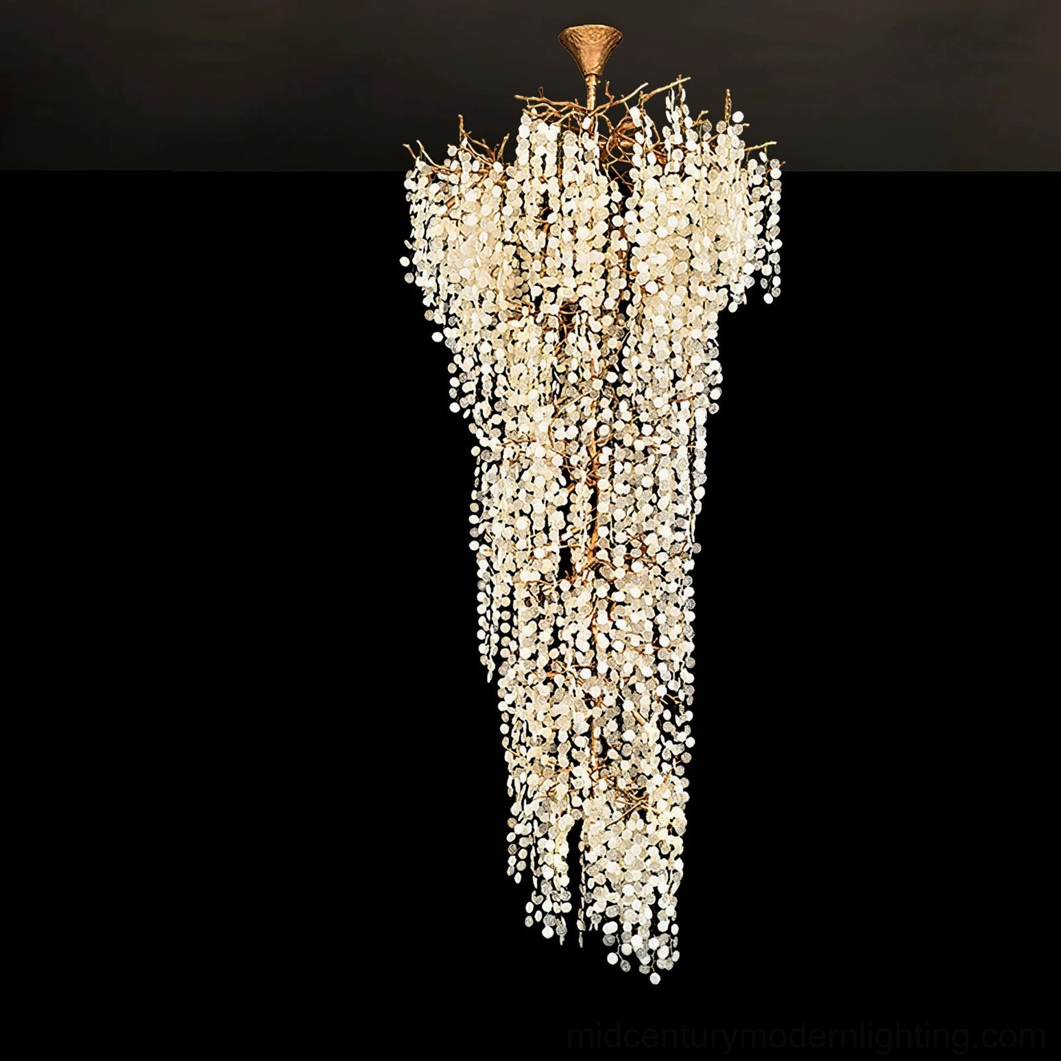 Shiro Noda medium cascading chandelier warm gold finish dark studio background details