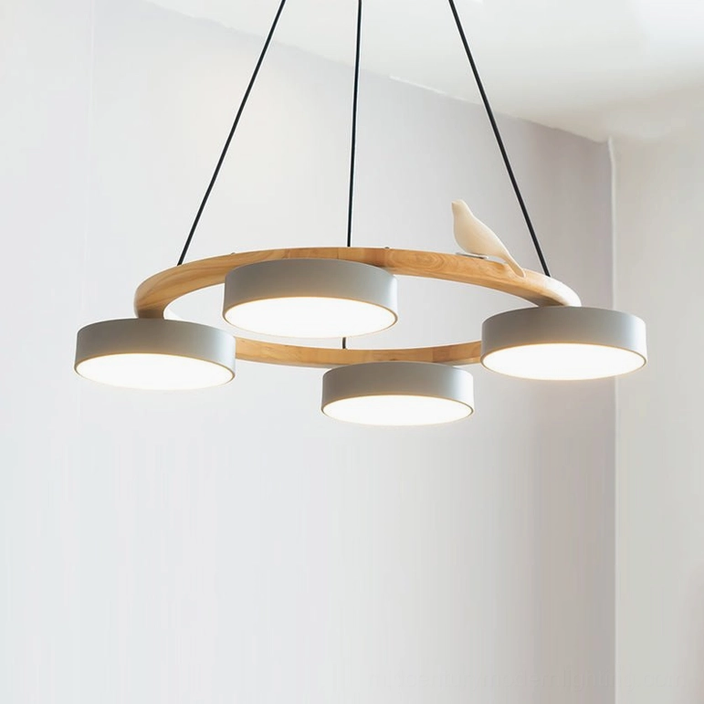 Sienna bird round pendant chandelier blue variant suspended showing gentle blue-gray tone and warm ambient lighting in interior space