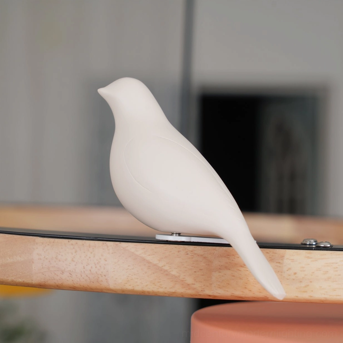 Sienna bird round pendant light ceramic bird ornament sculptural detail showing handcrafted quality on wood perch