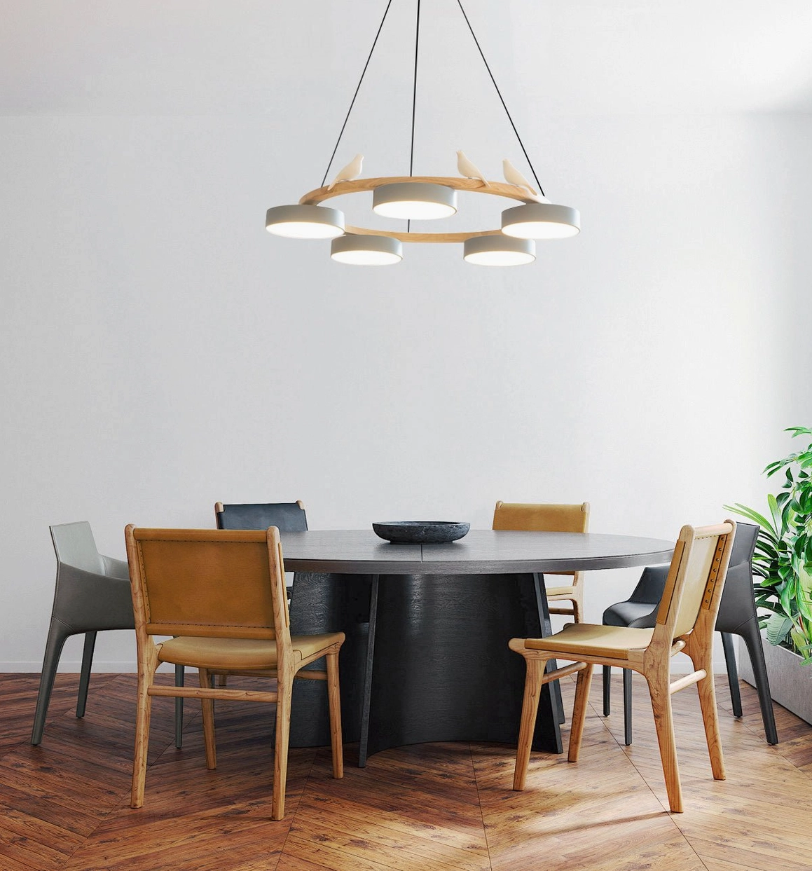 Sienna bird round pendant light installed in contemporary dining space with dark round table, wood frame and white diffusers create focal point