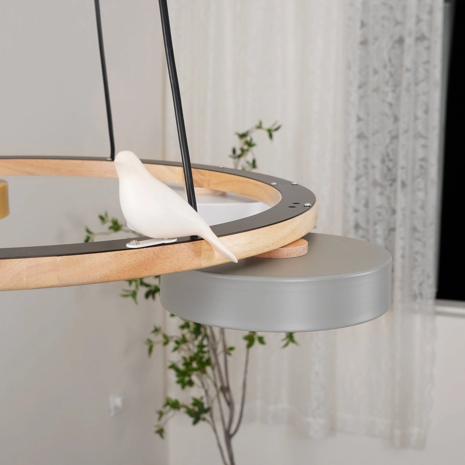 Sienna bird round pendant light showing integrated LED and frosted acrylic diffuser assembly with warm light emission