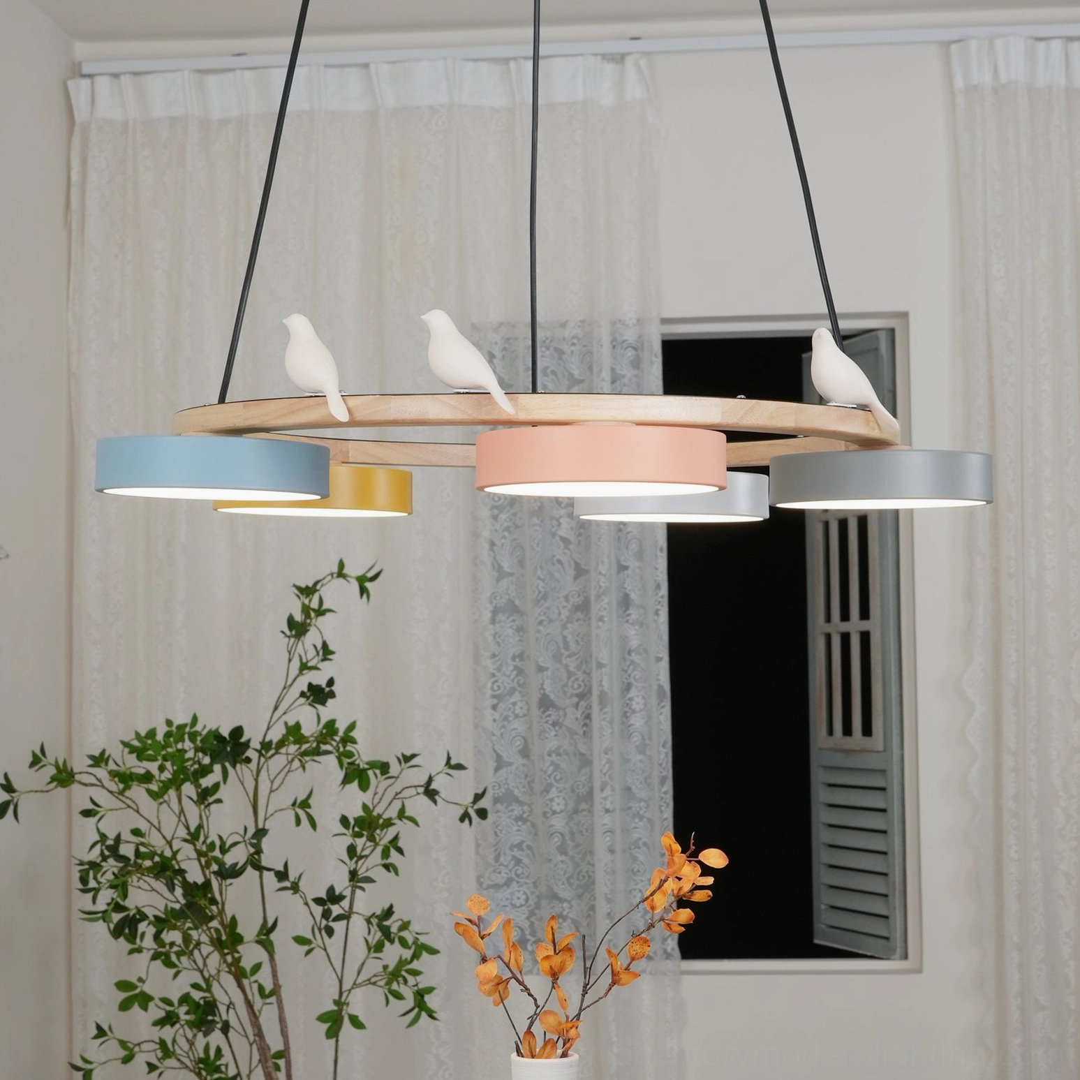 Sienna bird round pendant light showing wood grain texture and finish quality on natural stained frame section
