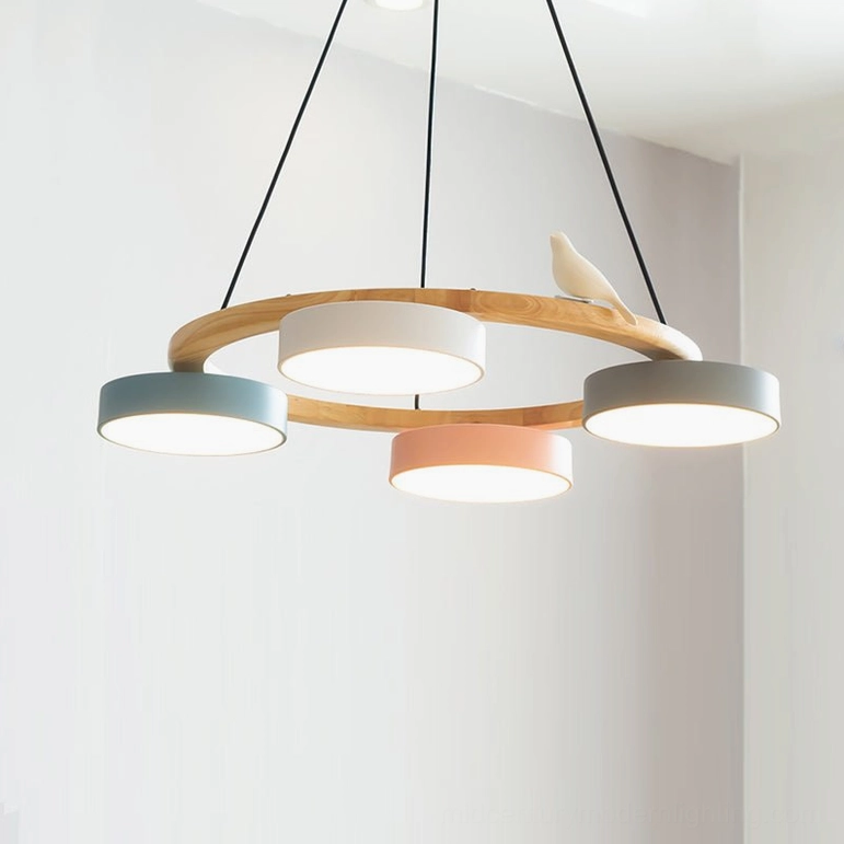 Sienna bird round pendant chandelier yellow variant showing vibrant golden tone wood finish with five frosted yellow shades