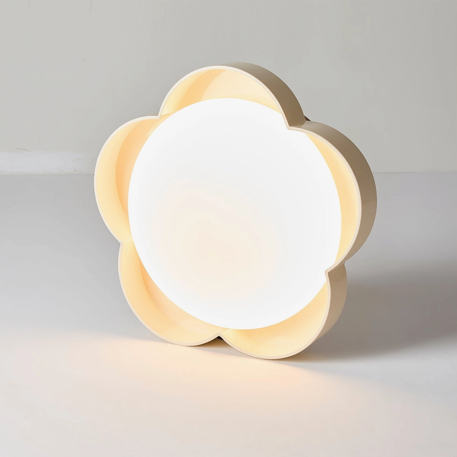 Sika organic light fixture in cream and beige finish with full matte white light panel, three-quarter front view