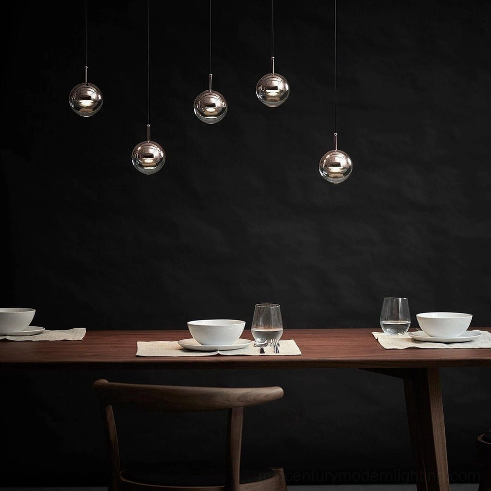 Silver polished spherical glass pendant chandelier in luxury dark-toned dining area contemporary lighting