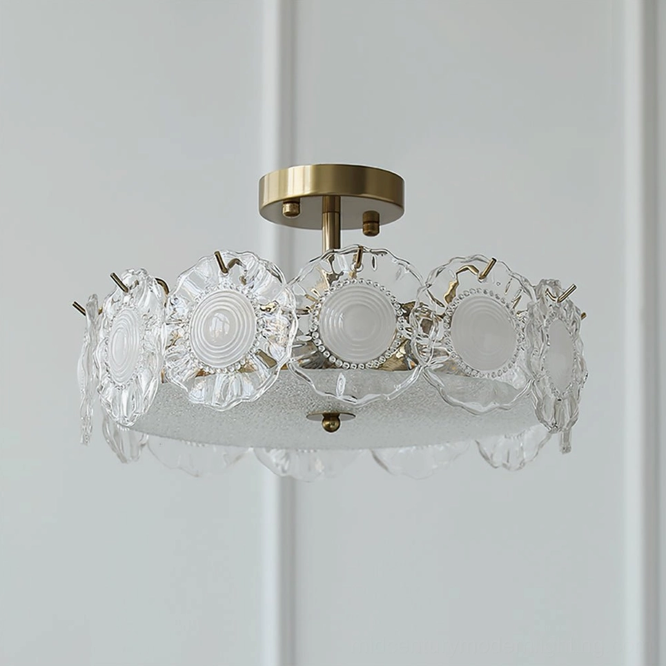 Single layer textured glass ceiling lamp with brass accents and embossed ripple design on white background