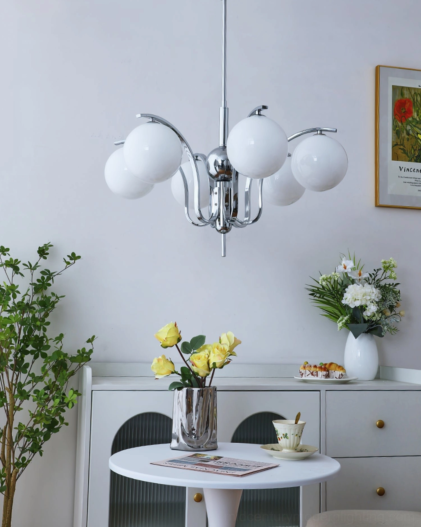 6-head frosted white glass sphere chandelier with polished chrome frame in dining area setting