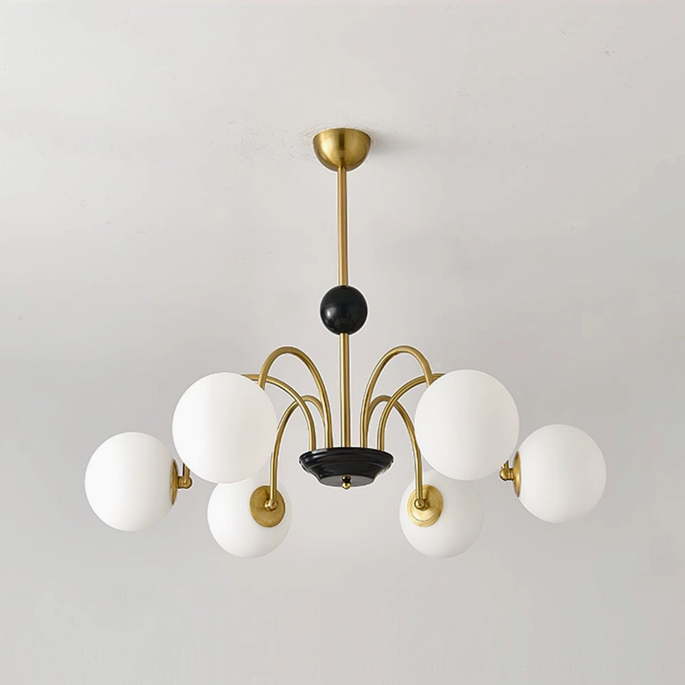 Six-head globe chandelier with gold-black finish and frosted white glass shades