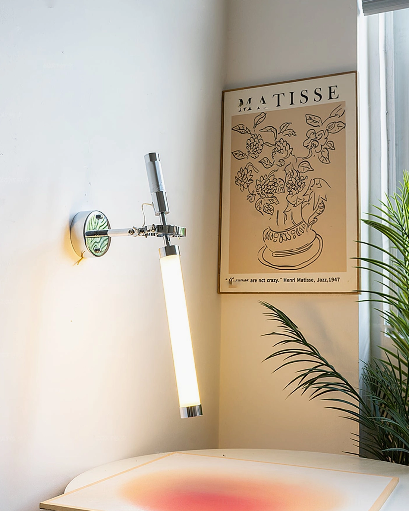 Skylark adjustable wall sconce with swing arm articulation and sleek linear proportions