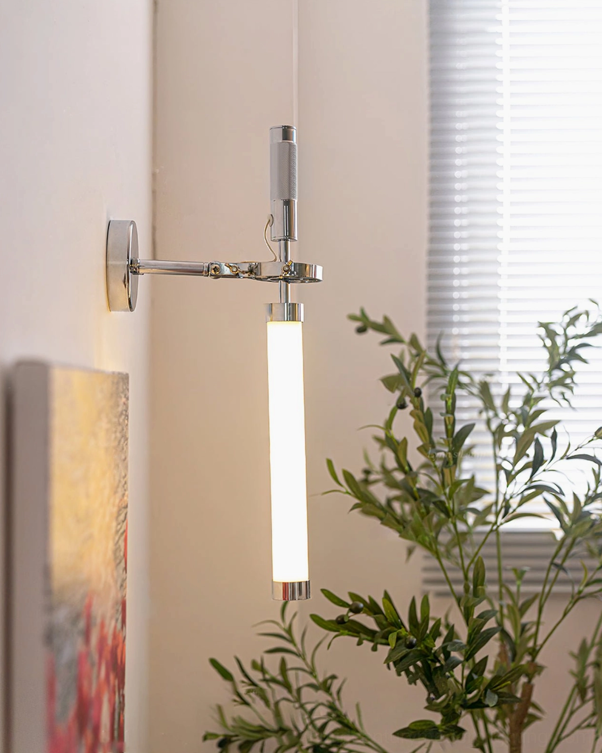 Rotating swing arm wall light with vertical frosted glass diffuser in bright bedroom setting