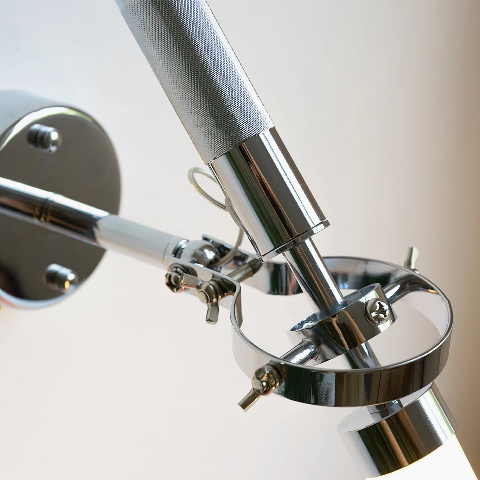 Skylark wall lamp knurled metal grip and chrome wall mount with swing arm mechanism