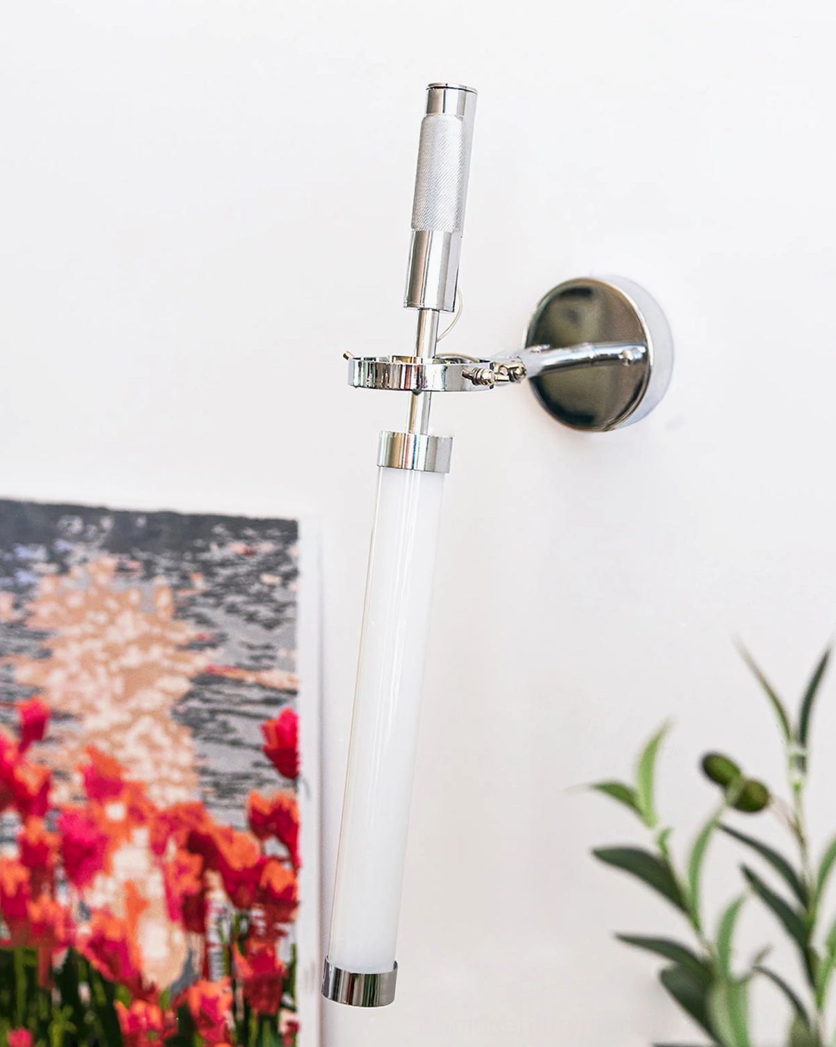 Skylark chrome wall lamp with adjustable arm mechanism and integrated LED technology