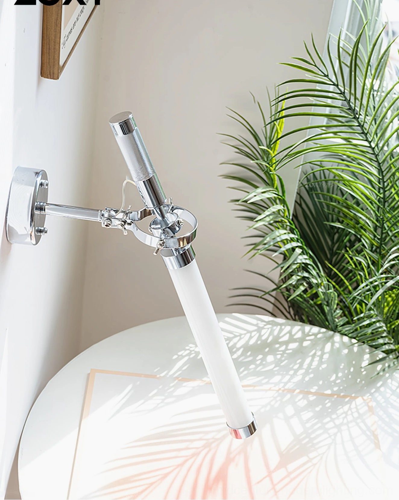 Modern minimalist wall-mounted lighting fixture with polished chrome and frosted glass