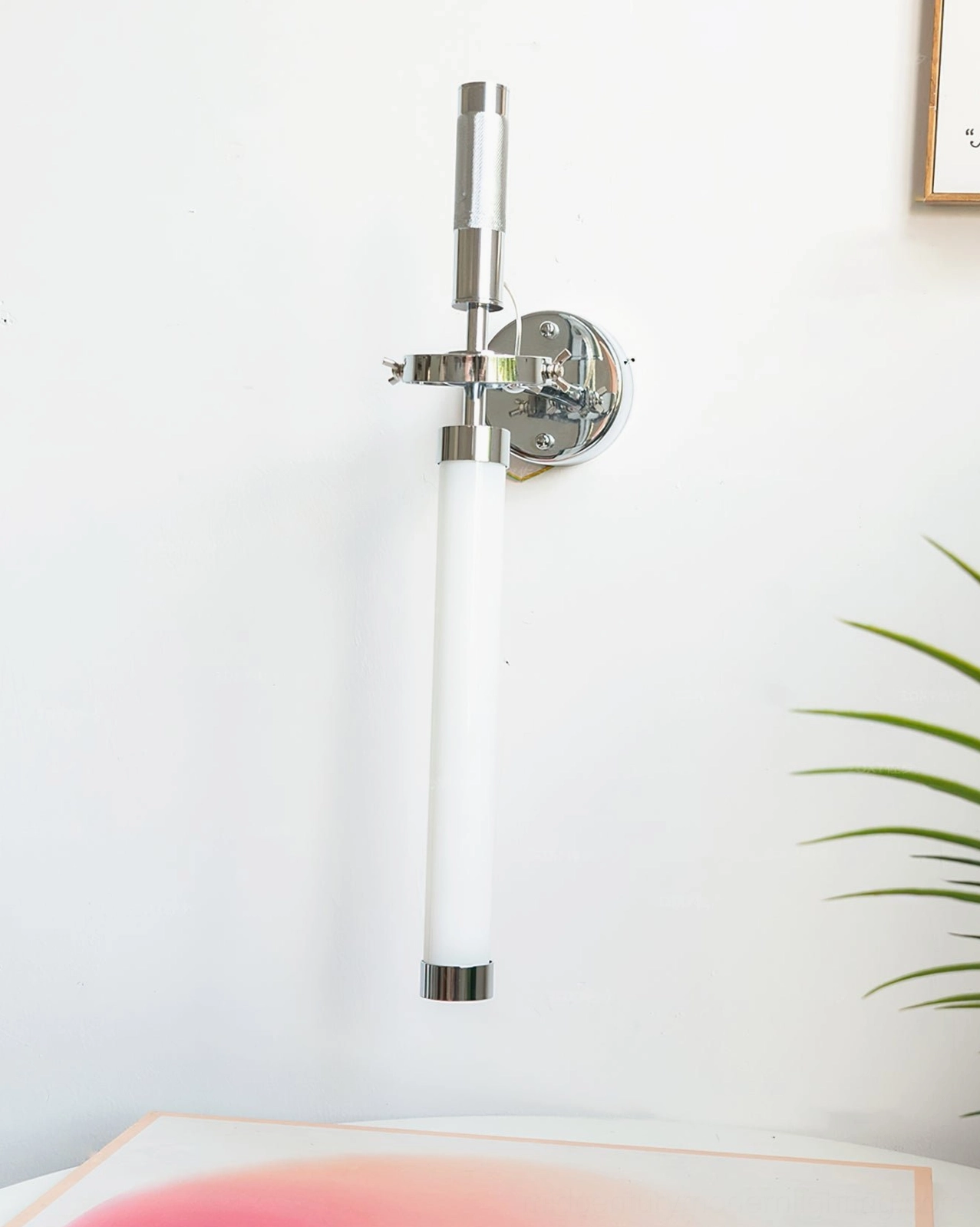 Vertical linear wall lamp with fixed installation, chrome end caps, and minimalist modern design