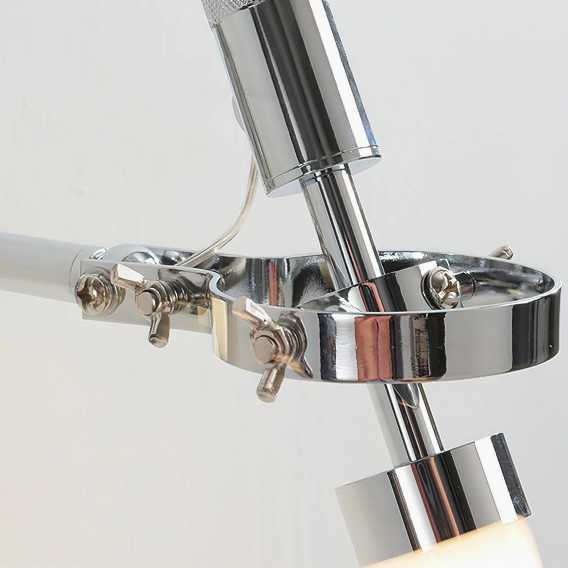 Close-up detail of Skylark chrome metal joint with adjustable rotating mechanism and fasteners