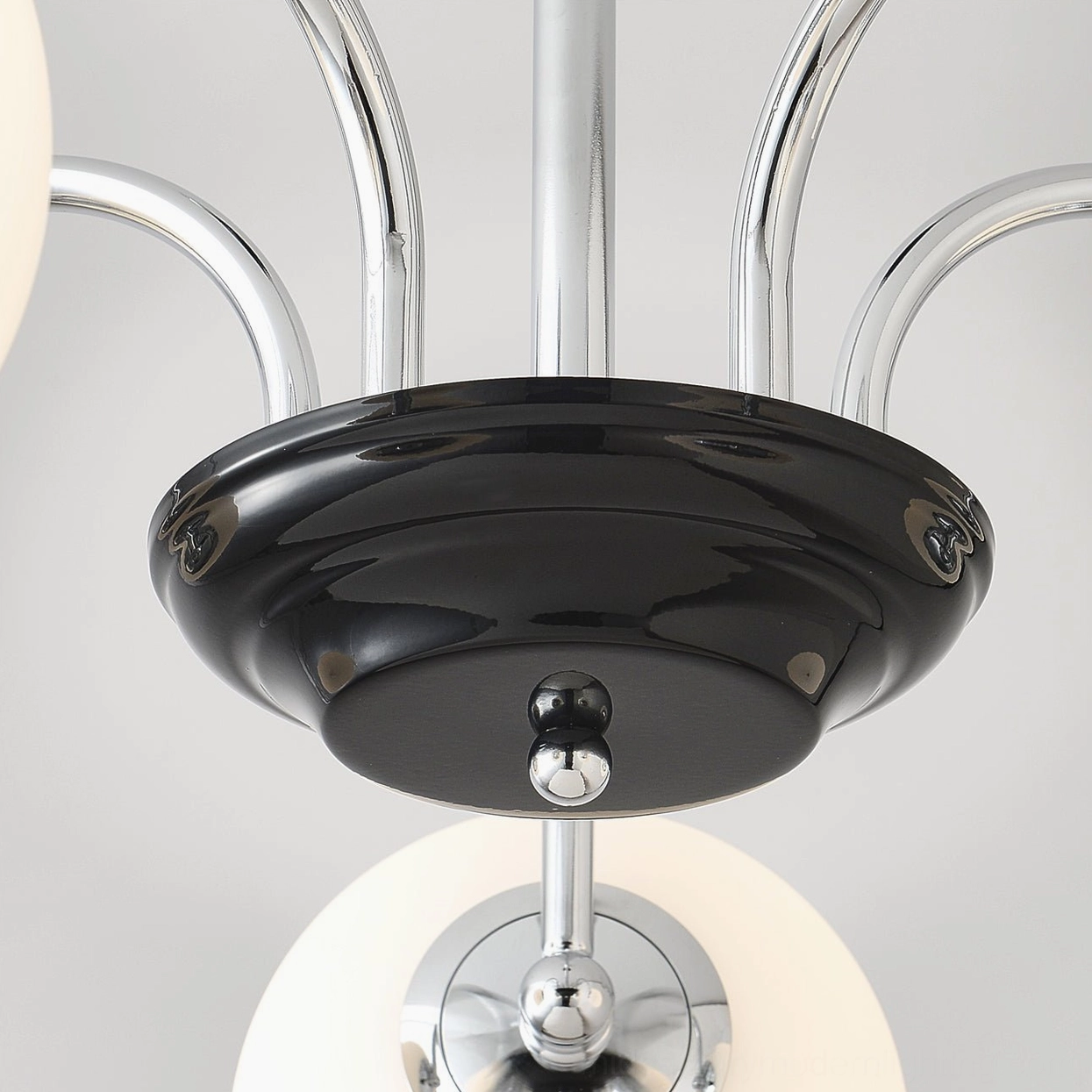 Pendant globe chandelier with sleek metal design and frosted glass spheres in modern interior