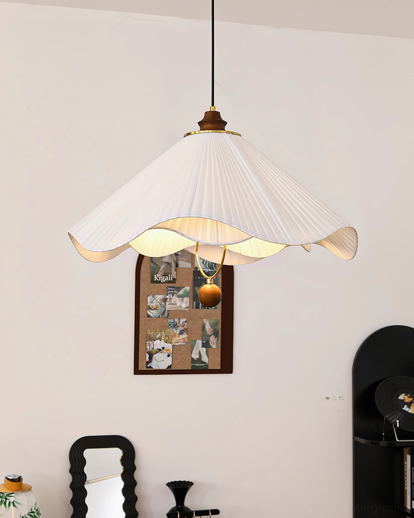 Sloane fabric pendant light three-quarter side view against plain white wall interior with brown spherical bottom ornament pendant