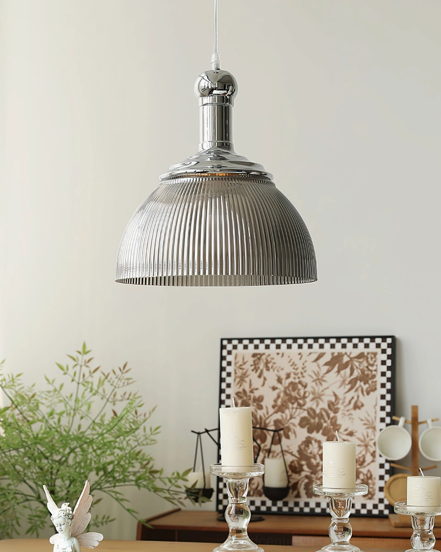 Smoke gray ribbed glass pendant lamp overhead view showing polished chrome hardware finish above dining table