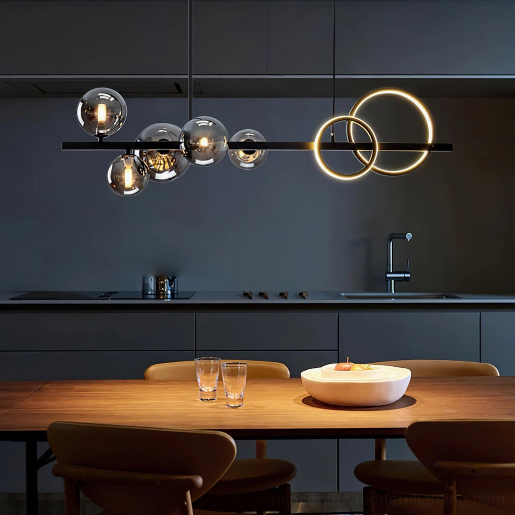 Linear pendant chandelier with amber smoked glass bubbles and black metal frame in kitchen dining space with warm ambient glow