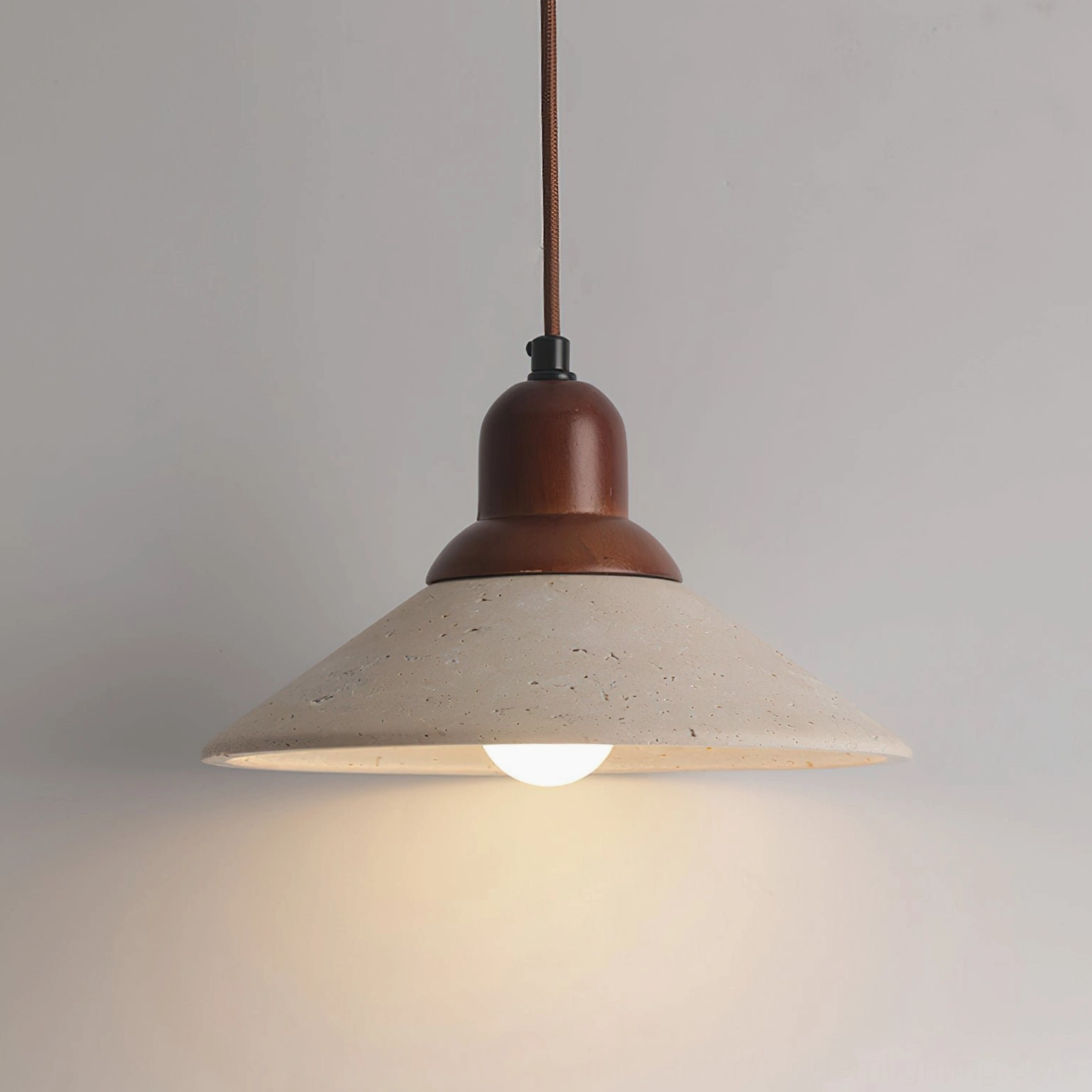 Solara pendant light with wood cap showing warm beige travertine and natural wood grain details