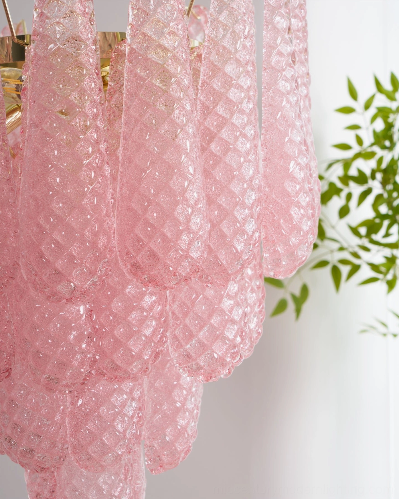 Pink hand-blown glass chandelier in sophisticated interior demonstrating style versatility