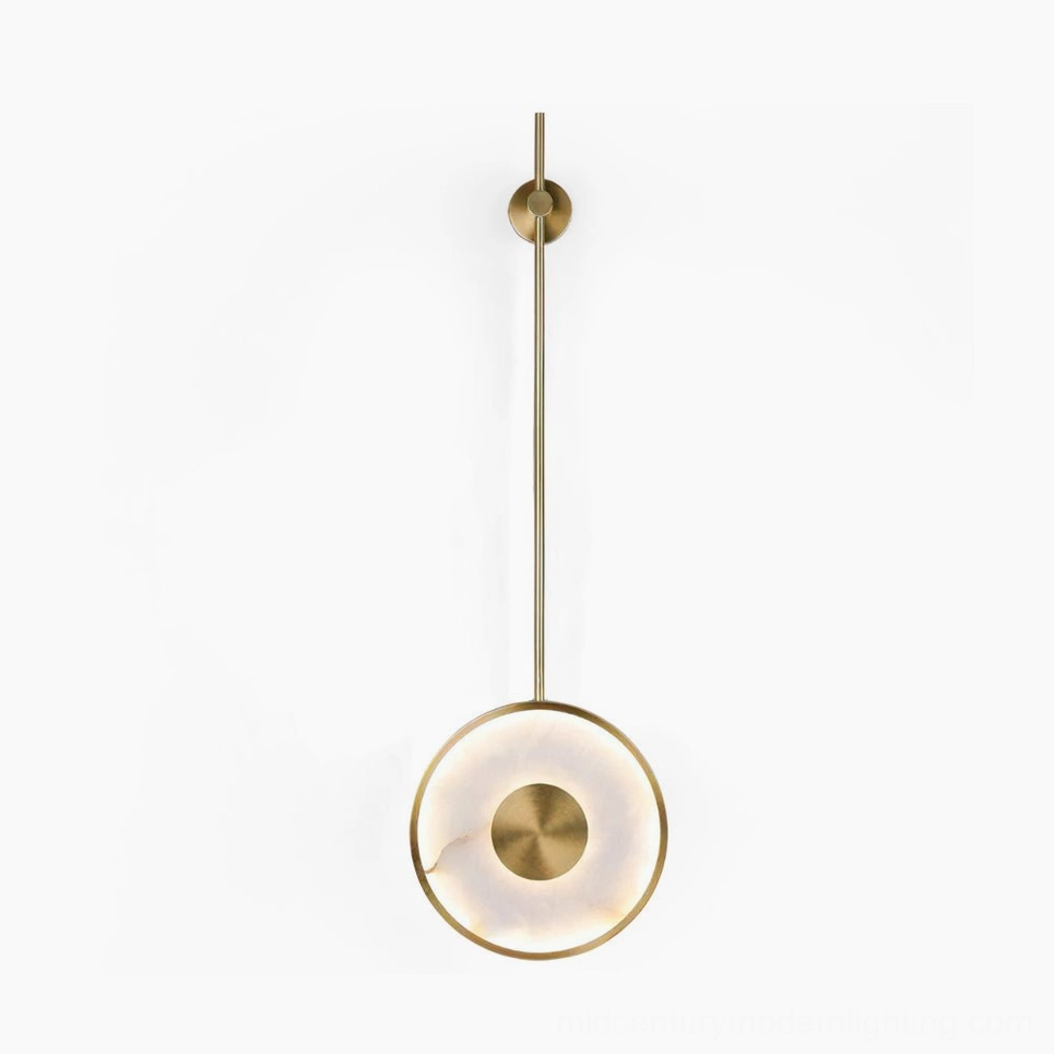 Sorle alabaster wall lamp front view, brushed gold finish with luminous stone disc mounted on slender iron rod