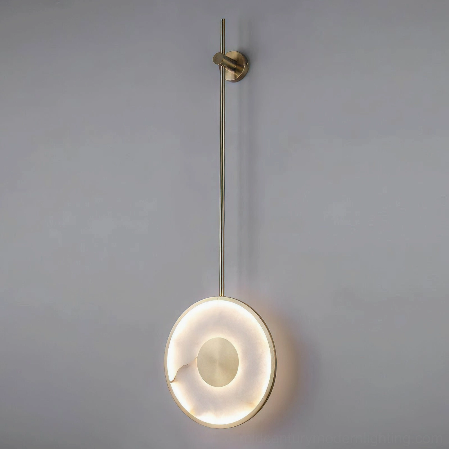 Sorle lamp illuminated front view, warm integrated LED light diffusing through natural alabaster stone