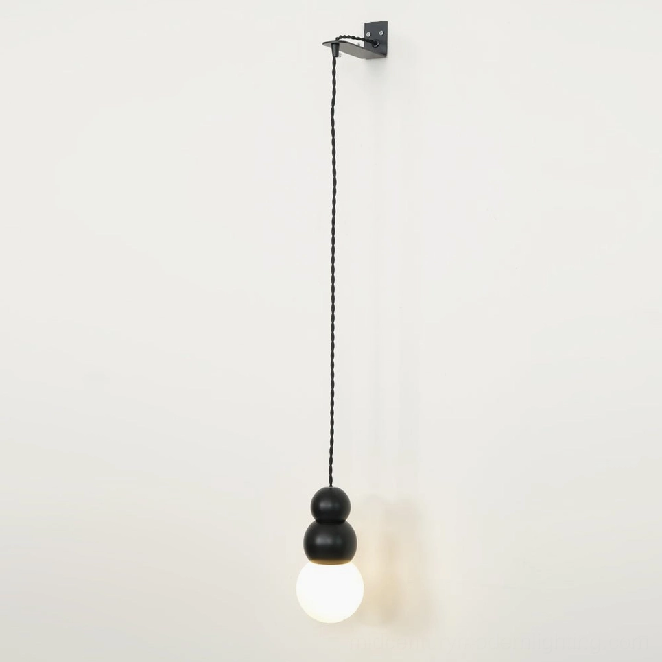 Spherical glass wall pendant with warm bulb, layered lighting effect, ambient home illumination