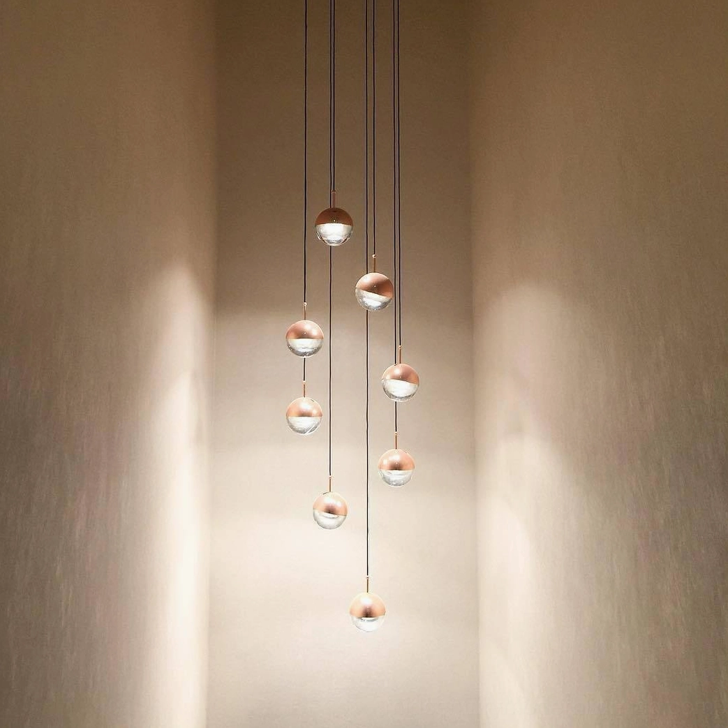 Spherical pendant light fixture modern minimalist interior ambient lighting configuration
