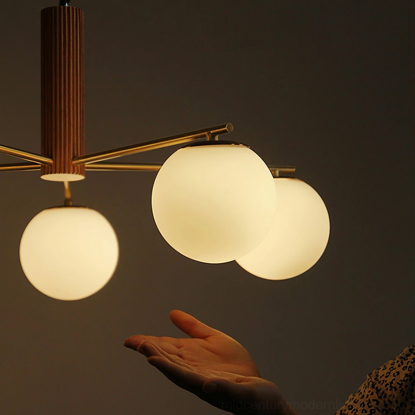 Sputnik ceiling light showing full illuminated view with warm ambient lighting effect