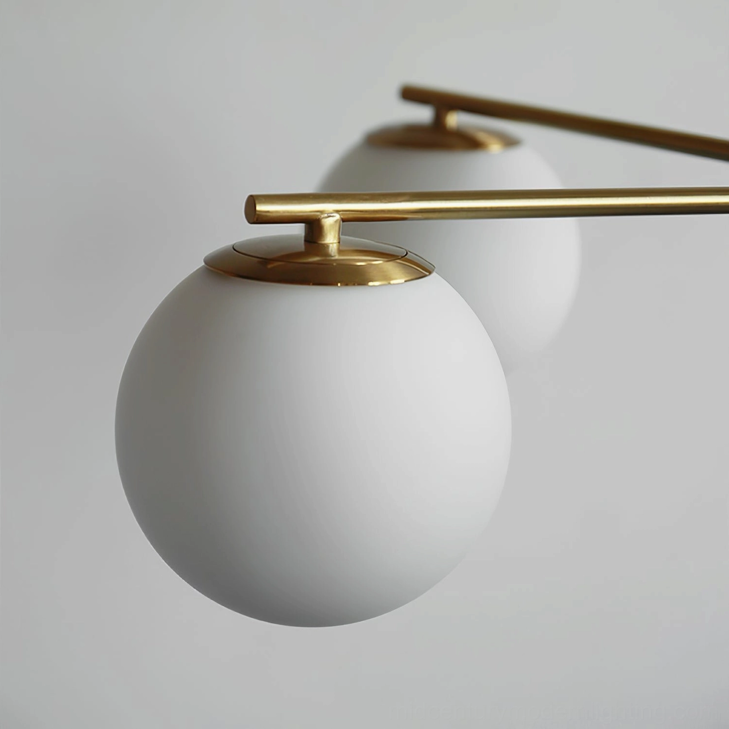 Sputnik chandelier three-quarter view showing brass frame and frosted white glass detail
