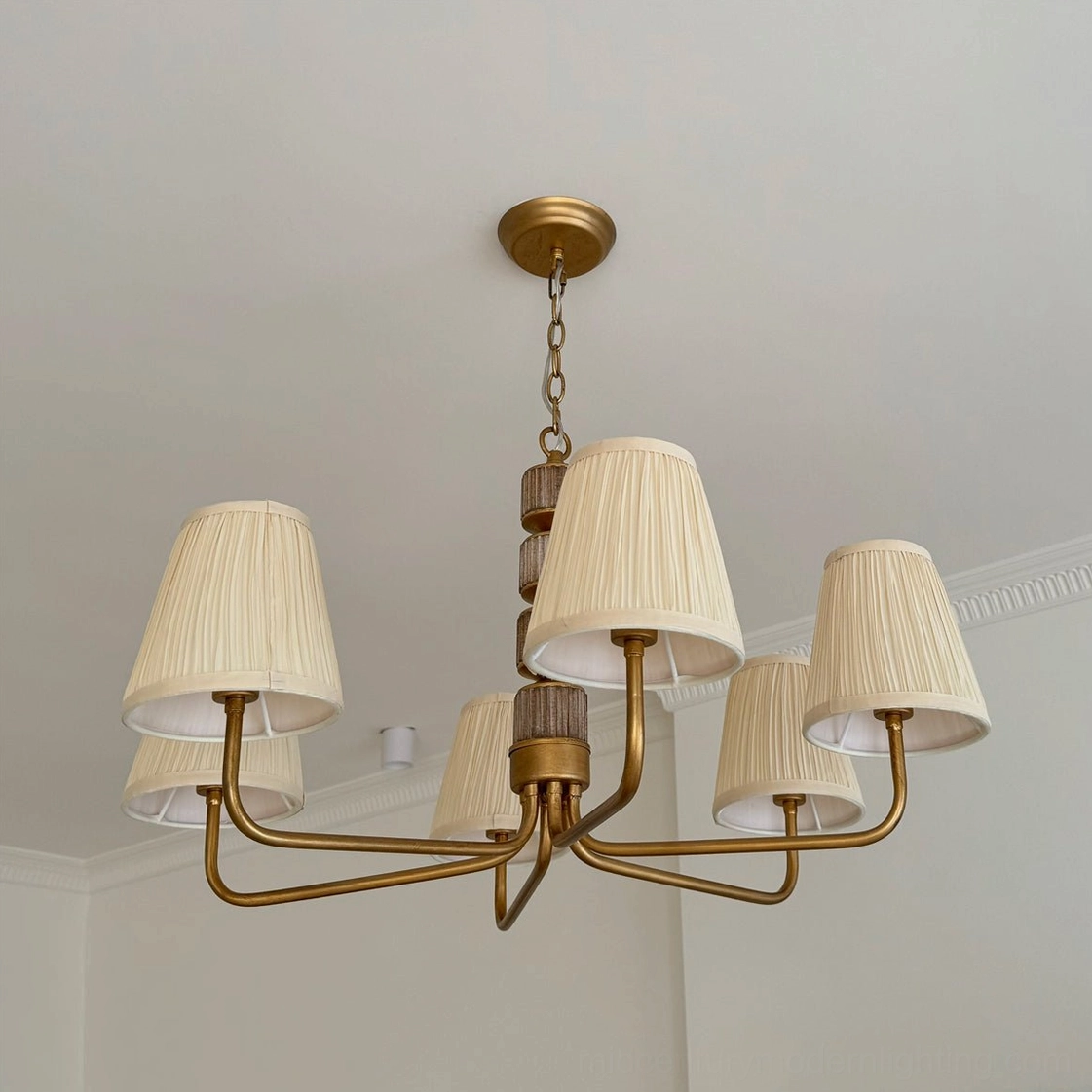 Stacey mid-century modern chandelier detailed construction showing pleated fabric shade craftsmanship and metal framework assembly