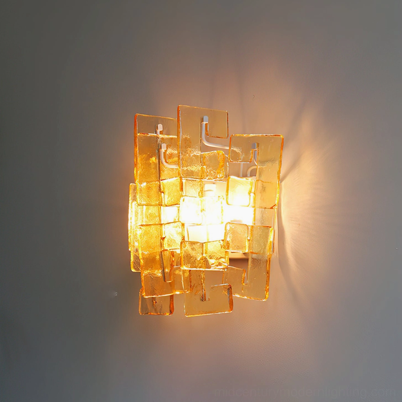 Stagger cast glass sconce amber tinted variant stacked block design warm ambient light