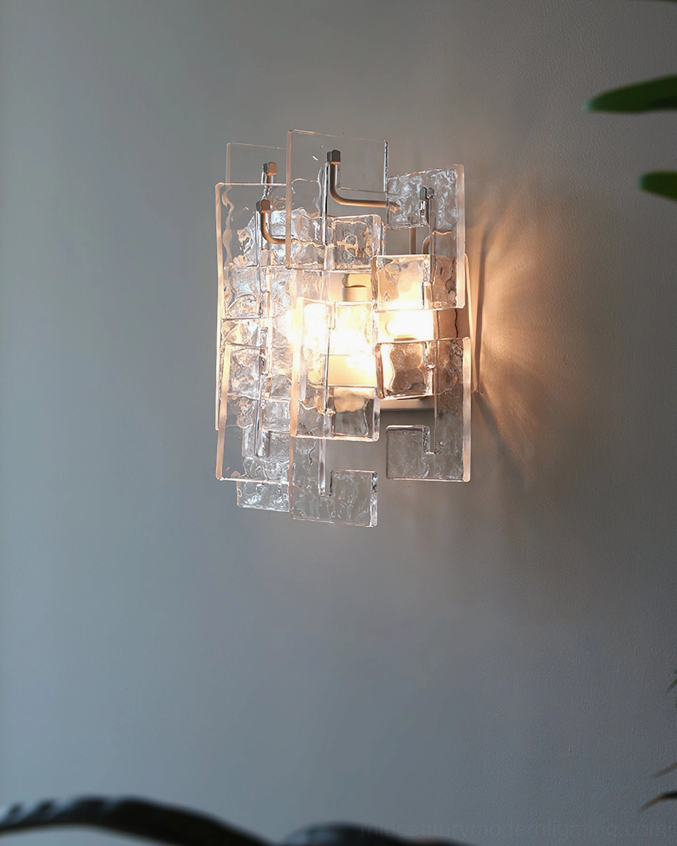 Stagger cast glass wall sconce architectural detail metal bracket hardware assembly