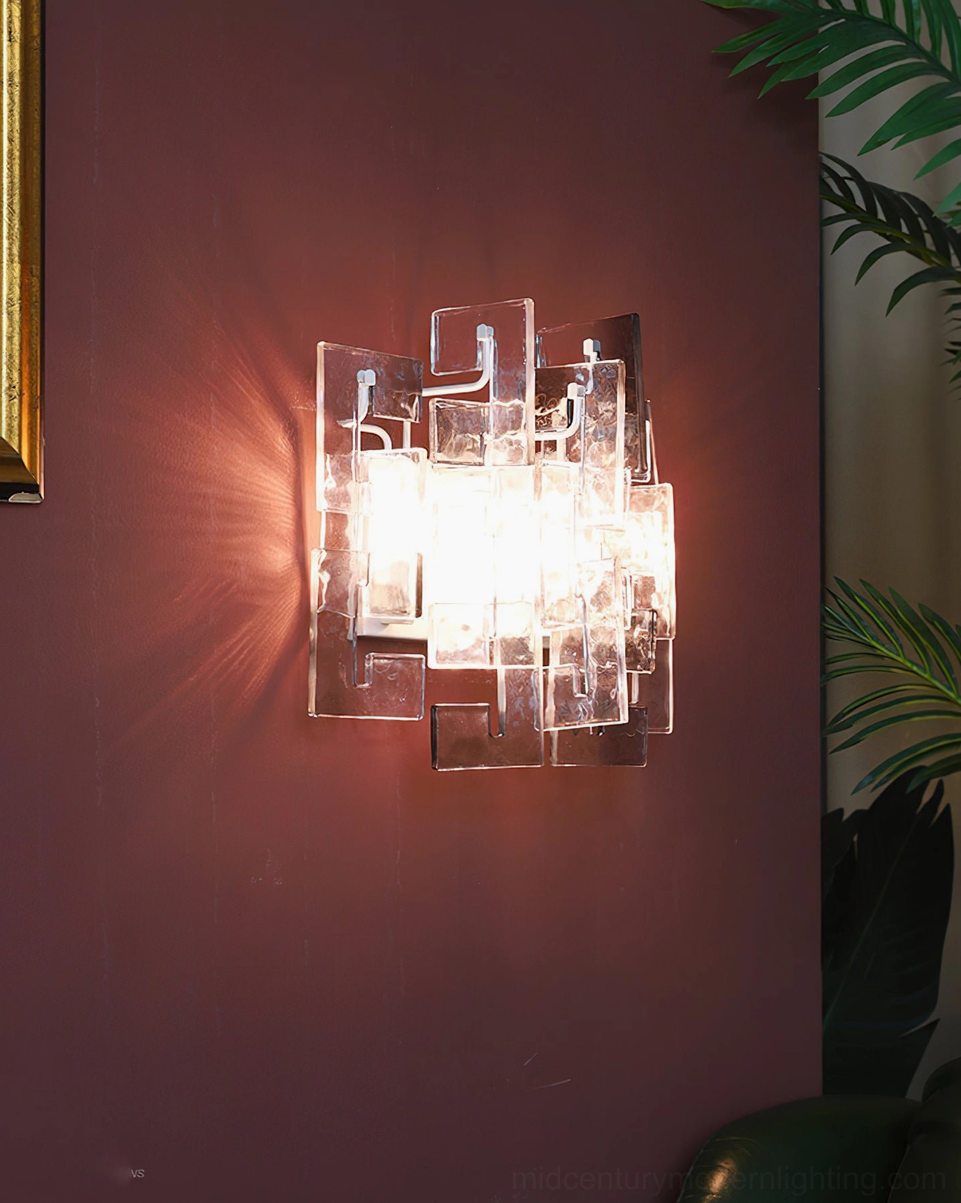 Stagger cast glass sconce clear glass mounted burgundy wall dark hardware bright interior light