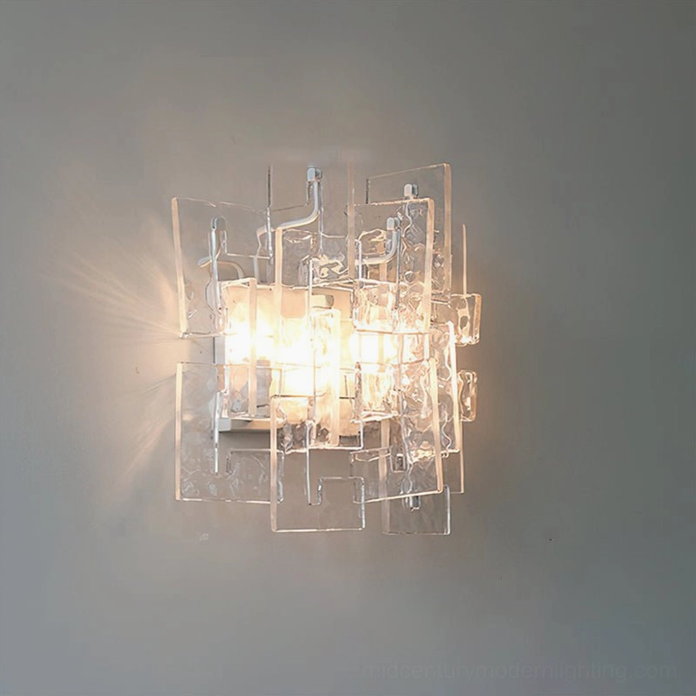 Stagger cast glass wall sconce clear glass pristine transparency geometric form