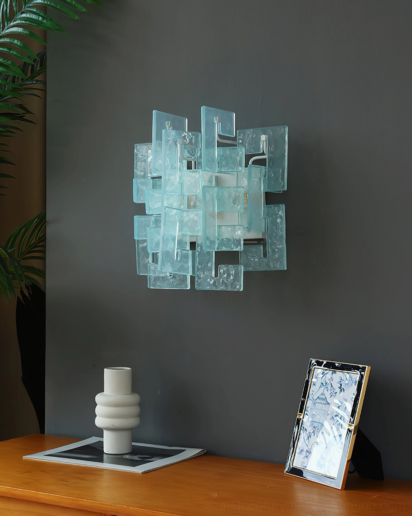 Stagger geometric cast glass wall sconce architectural detail shadow light pattern
