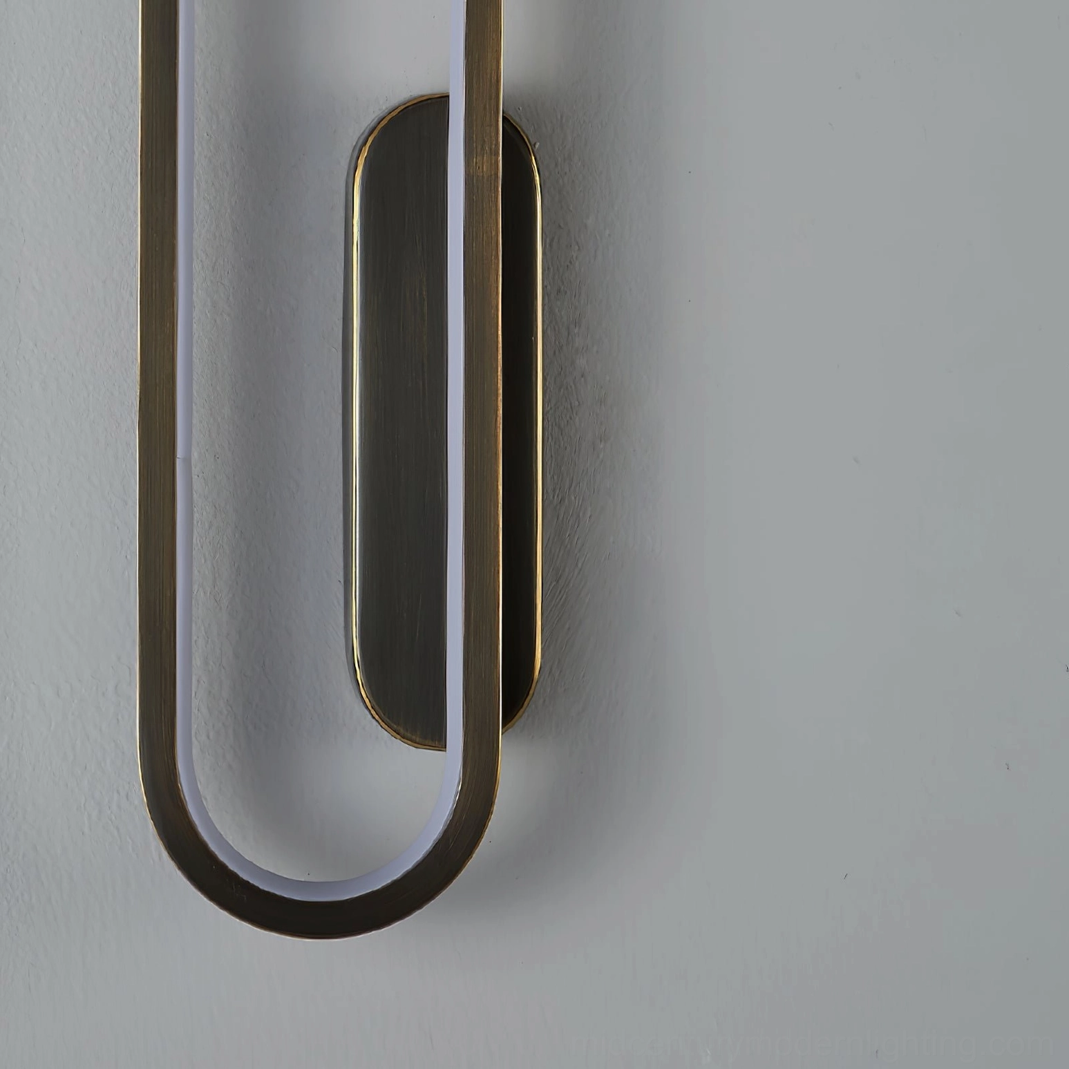 Gold brushed Starkey wall sconce highlighting Scandinavian minimalism and mid-century modern aesthetics