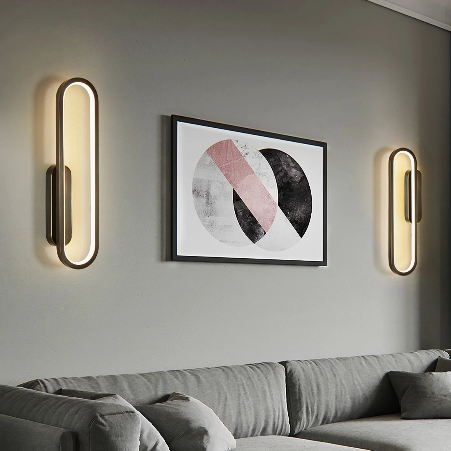 Pair of matching symmetrical Starkey minimalist wall sconces in modern living room with gray sofa