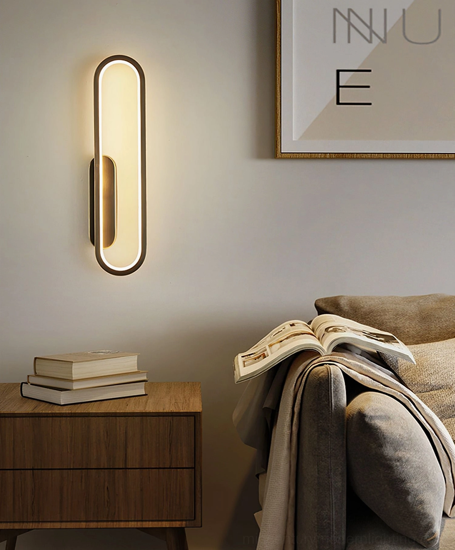 Dual finish Starkey wall lamp in brass and black mounted in bedroom corner with warm ambient lighting