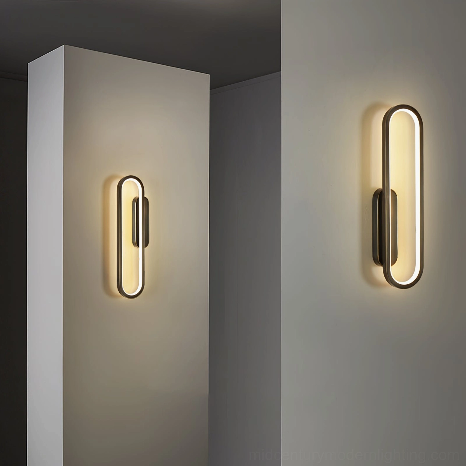 Two matching minimalist Starkey wall sconces in hallway perspective with warm ambient lighting effect