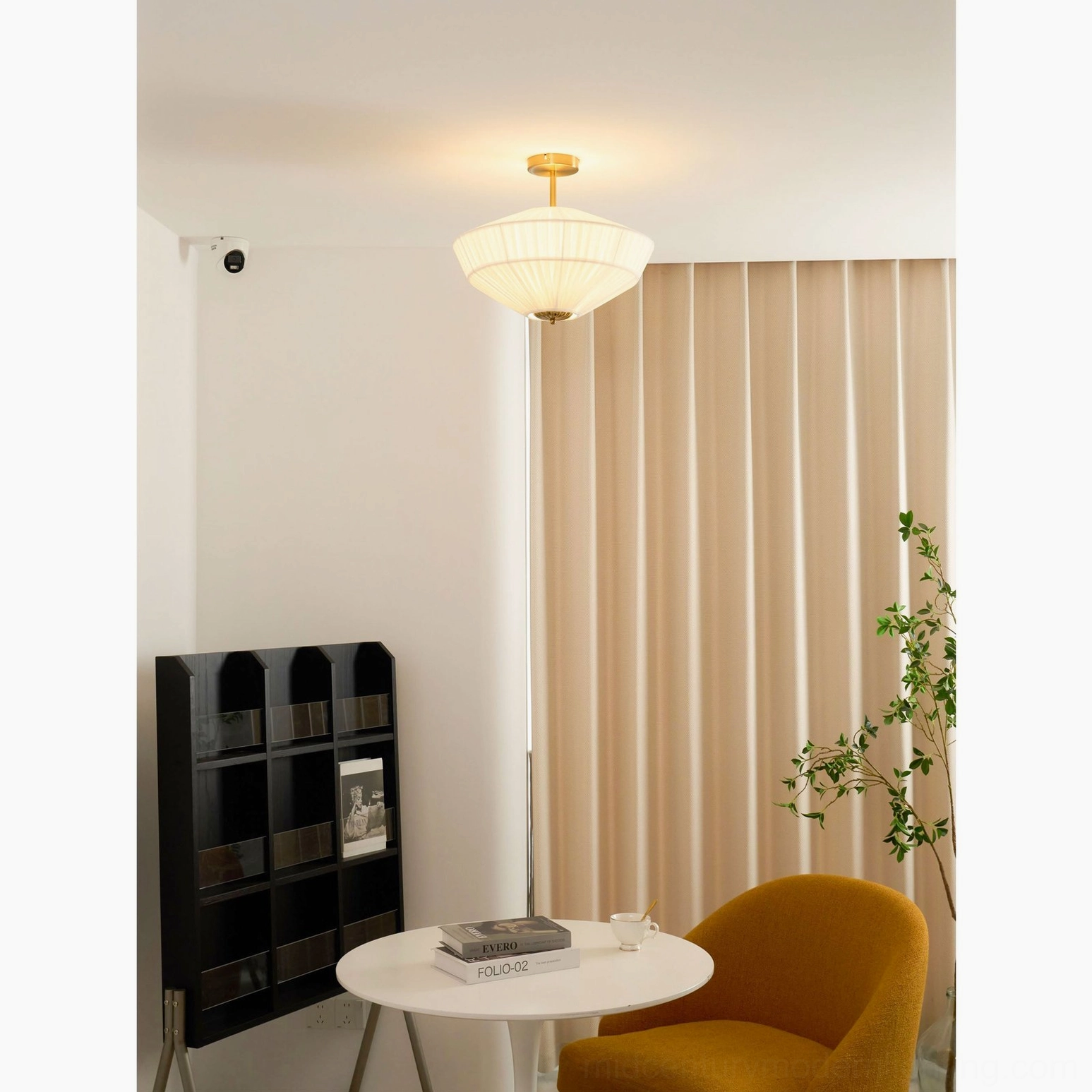Stefanie ceiling lamp showing fine vertical fabric pleats and detailed brass gold finish hardware