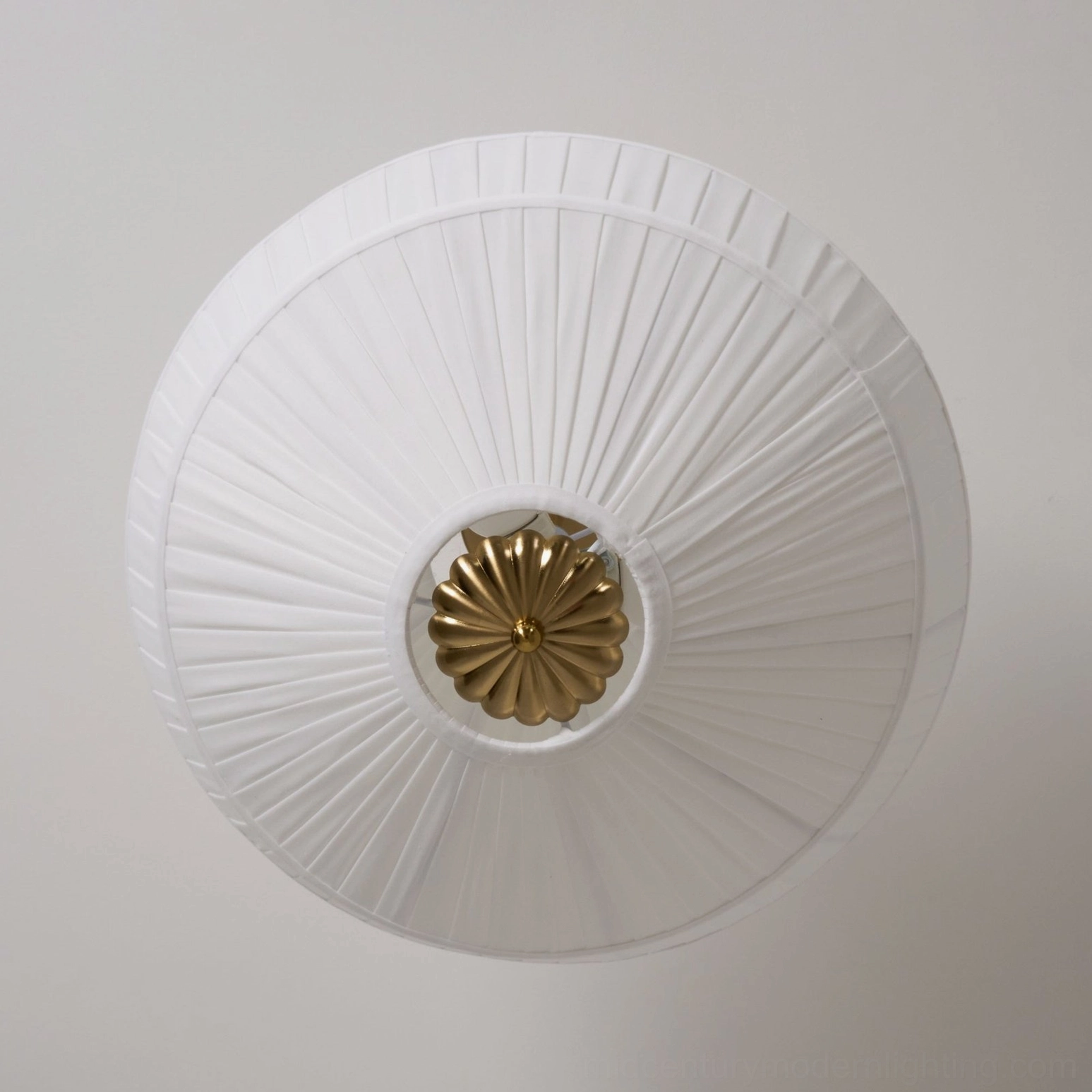 Stefanie ceiling lamp close-up showing delicate fabric pleats and sculptural form of shade