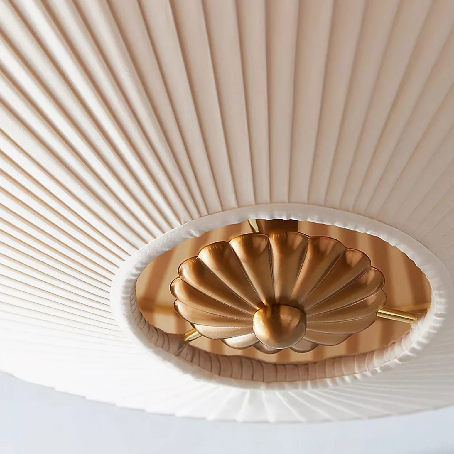 Extreme close-up of Stefanie pleated ceiling lamp highlighting fine fabric pleats and detailed brass gold fixture hardware
